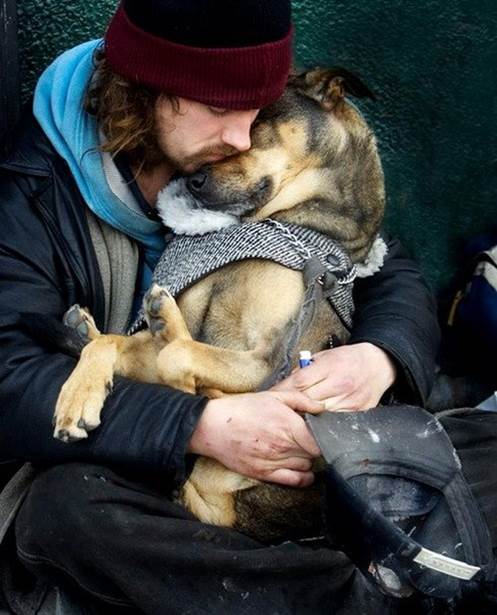Man and dog giving each other comfort